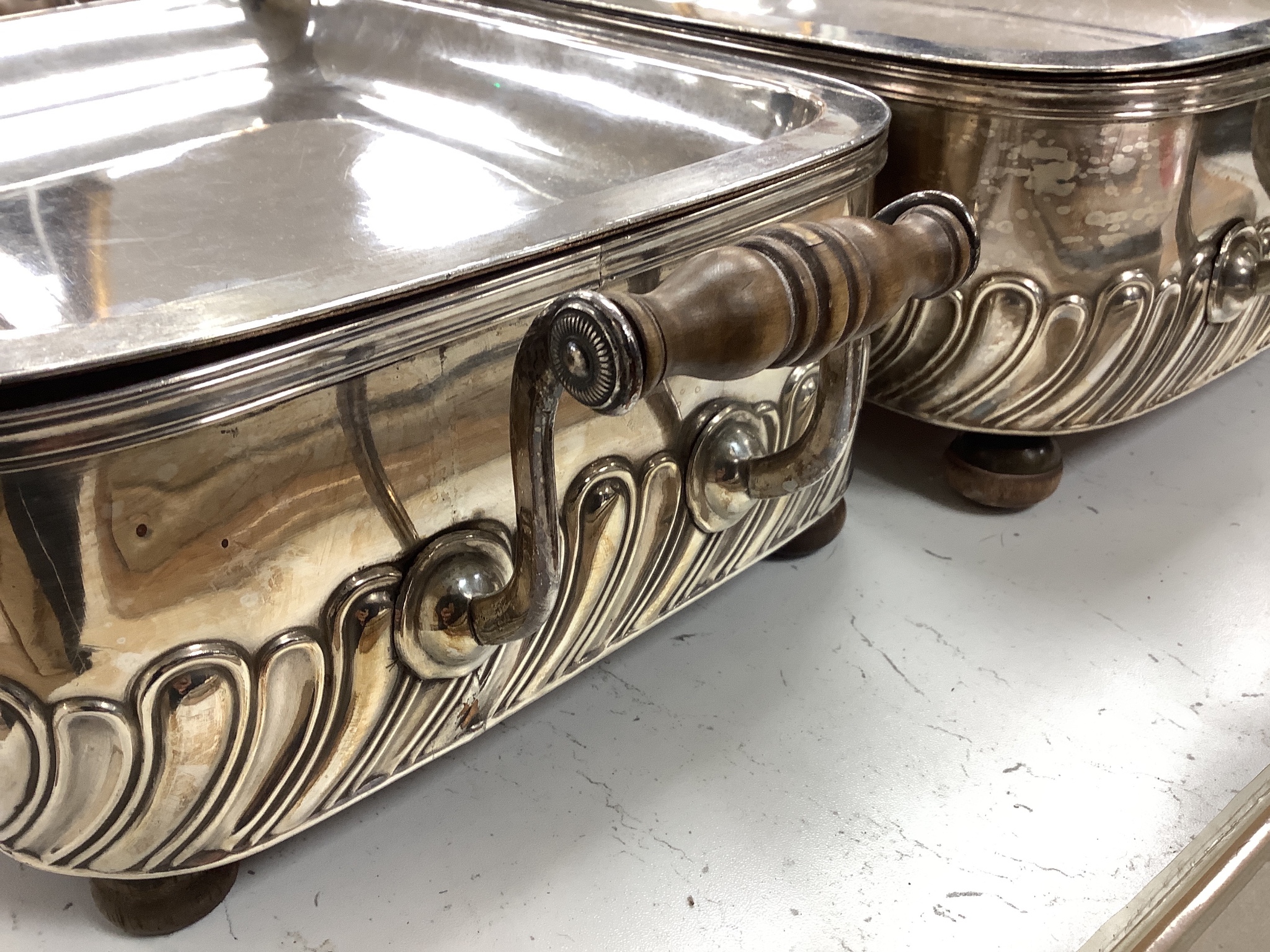 A pair of old Sheffield plated chafing dishes, width overall 40cm, and another similar dish